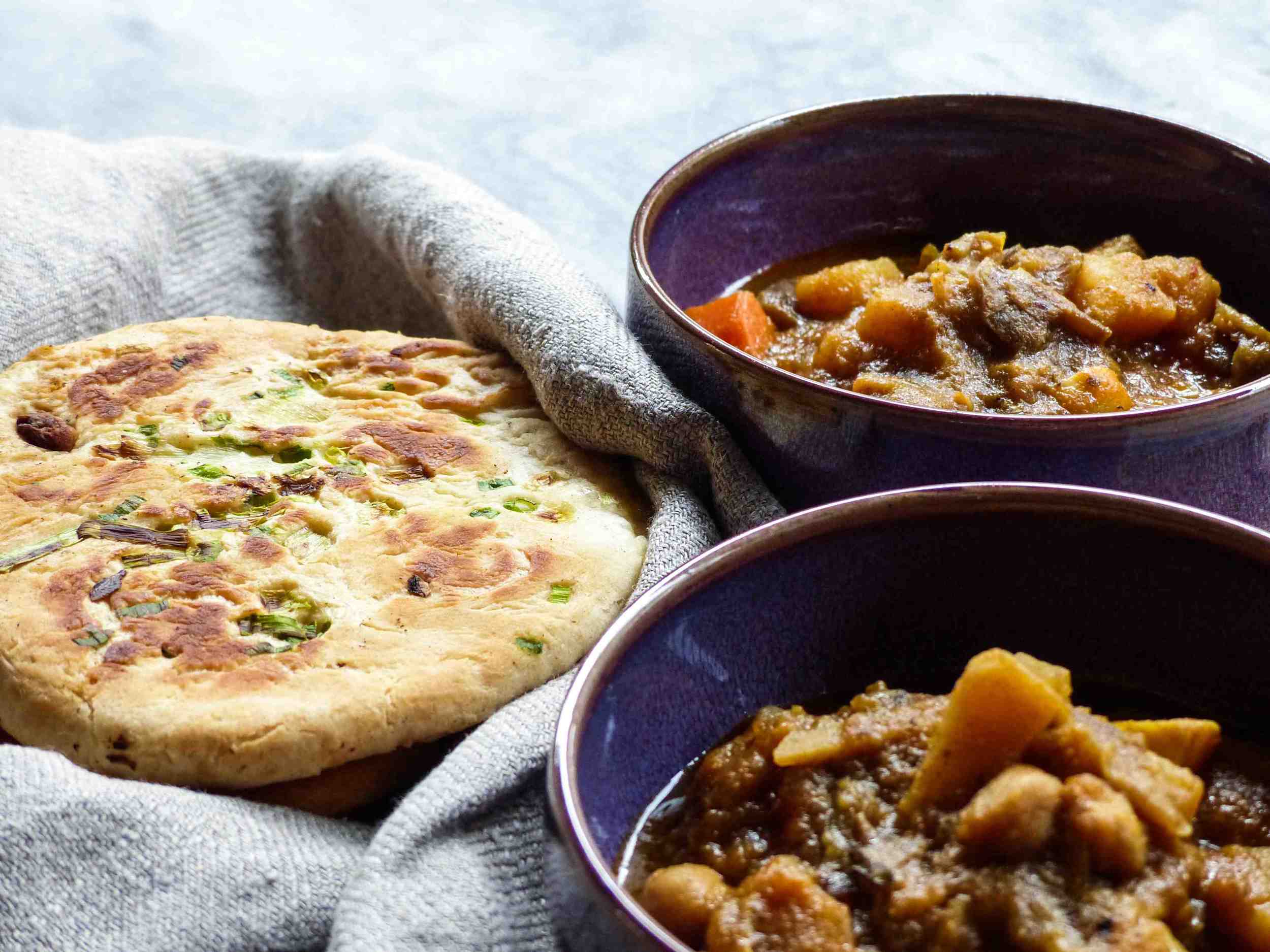 Recipe for Naan -- Servings: 8 naan Preparation Time: 20 minutes Cook Time: 2 minutes for each naan Ingredients: 4 cups all-purpose flour 1 tsp salt 1.5 tsp baking powder 1 tsp baking soda 1 tbsp sugar 1/4 cup warm water 1 tsp dry yeast 1 cup warm milk 1 cup greek yogurt 3-4 tbsp melted butter 1/2 cup chopped spring onion Instructions: 1) Dissolve water, sugar, and dry yeast in a small bowl. Let it sit for 10 minutes and allow the yeast to foam up. 2) In a large mixing bowl, mix flour, salt, baking soda, and baking powder. Then add the yeast mixture along with greek yogurt and milk to the mixing bowl. You may use a wooden spoon or spatula for mixing and start kneading with your hands after. When the wet and sticky dough forms, cover the bowl with a damp towel and allow it to rise in a warm place for 1 hour. 3) Divide the dough in 8 small balls equally. Use a rolling pin to flatten the dough on a lightly floured surface. 4) Brush melted butter and sprinkle scallions on each side of the flattened dough. Sprinkle a tiny bit of sea salt if you desire. 5) Preheat a skiller or frying pan on medium low heat, cook each side of the naan for 1-2 minutes with a lid on. 