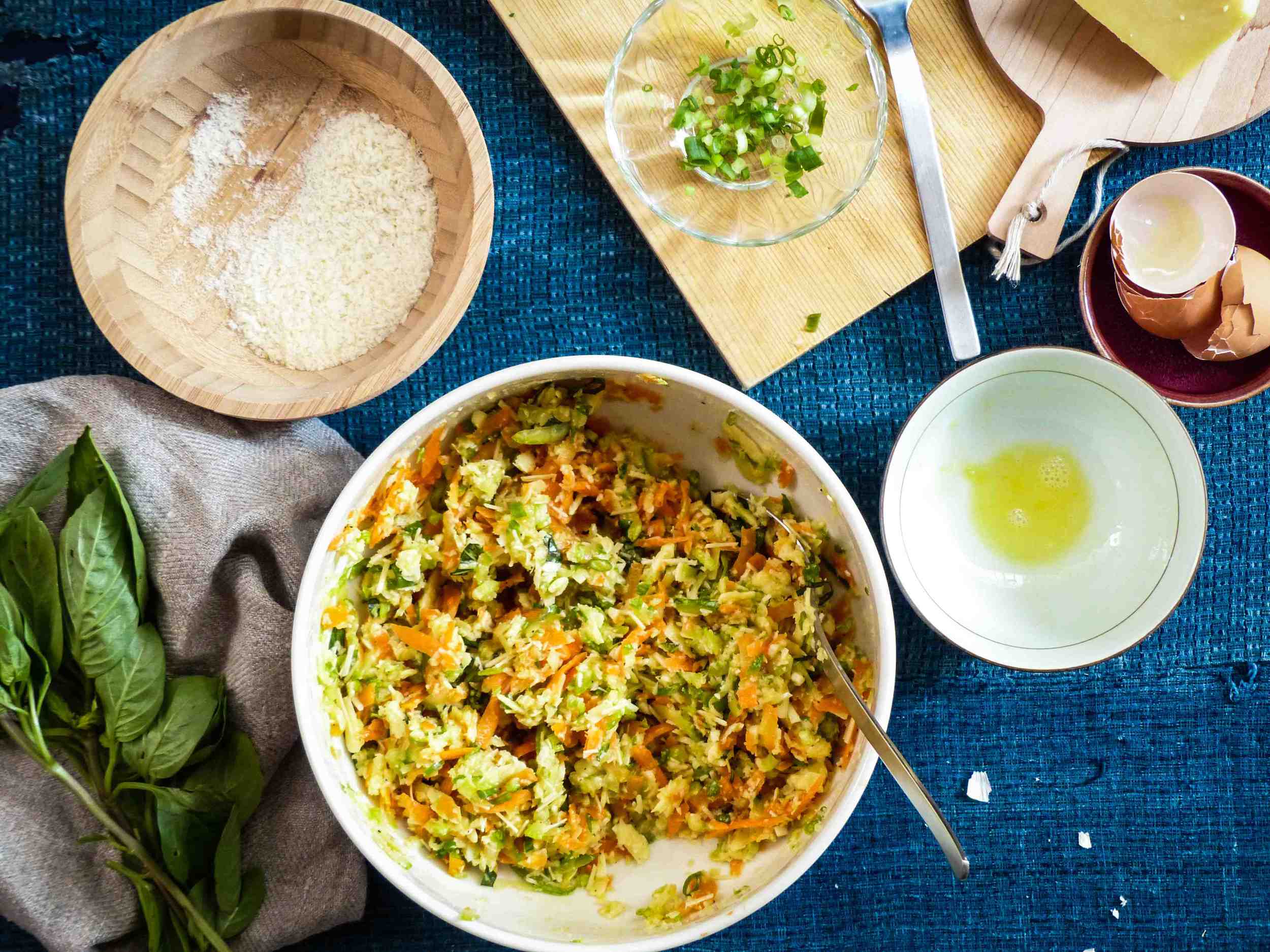 Add garlic, cheese, fresh basil, spring onion, egg, and breadcrumbs. Season. Mix well. 
