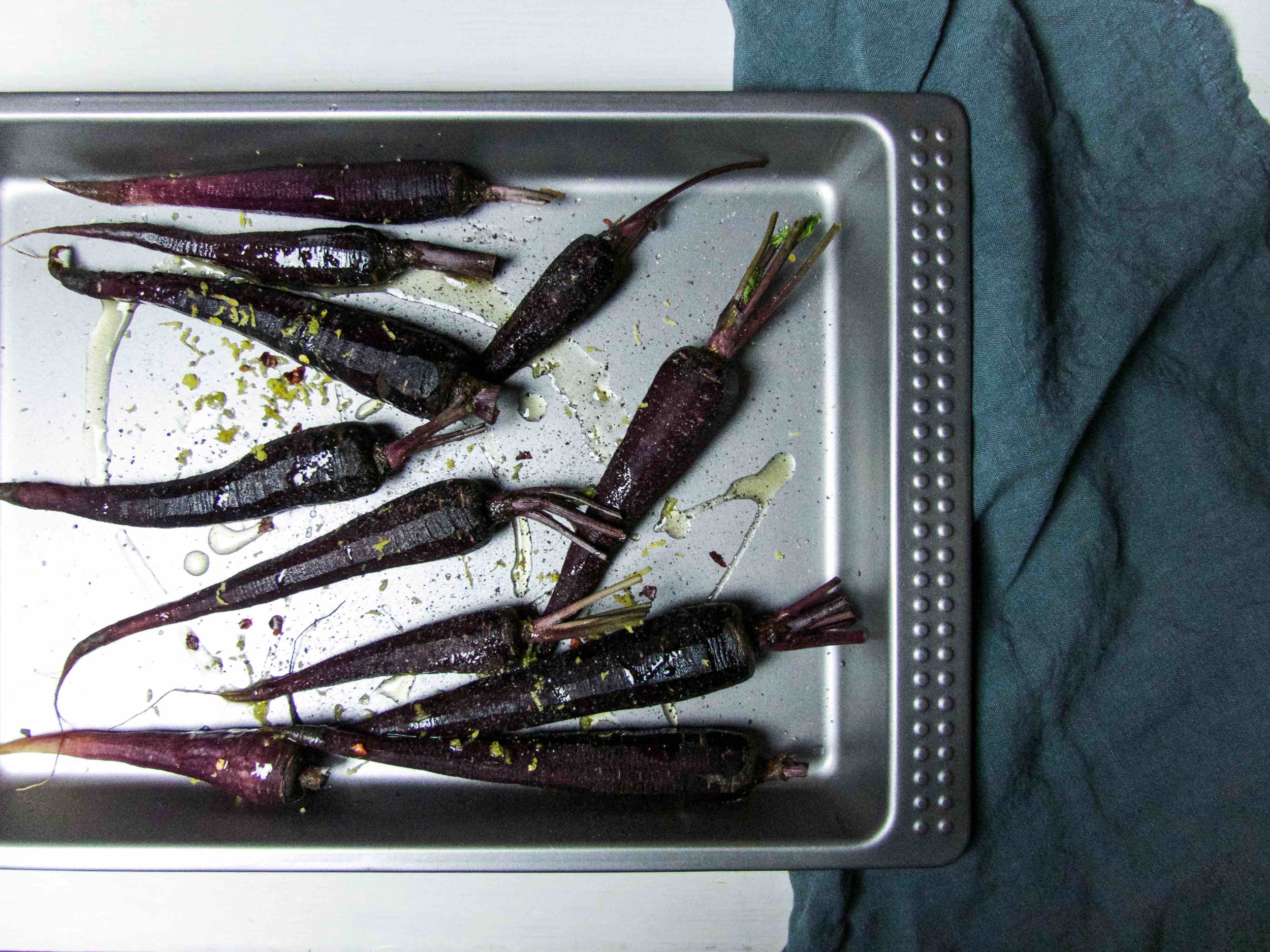 On a baking tray, mix carrots, oil, and season. Roast for about 15 minutes then add avocado.