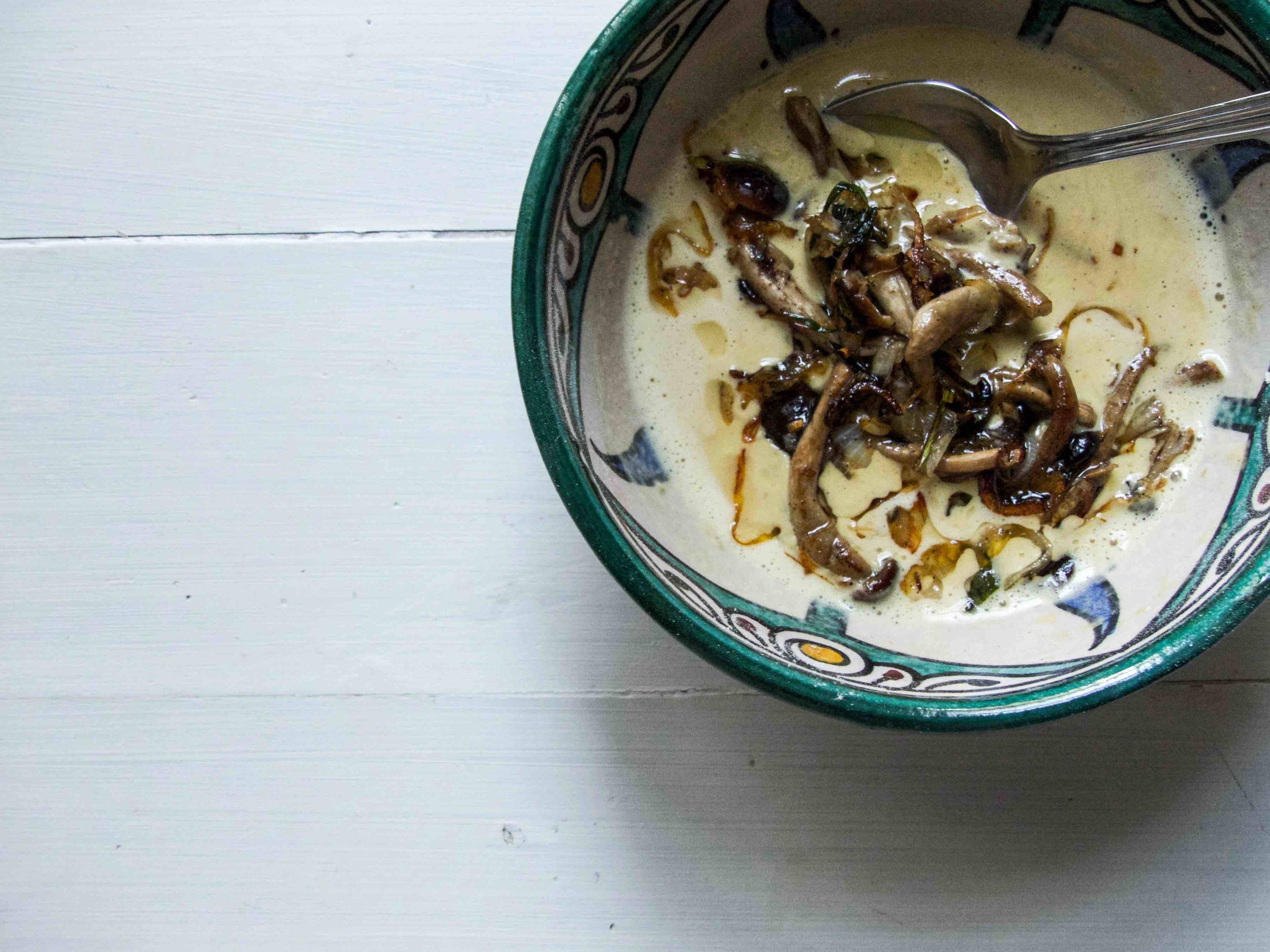 Add the cooked mushroom mixture to the omelette batter.