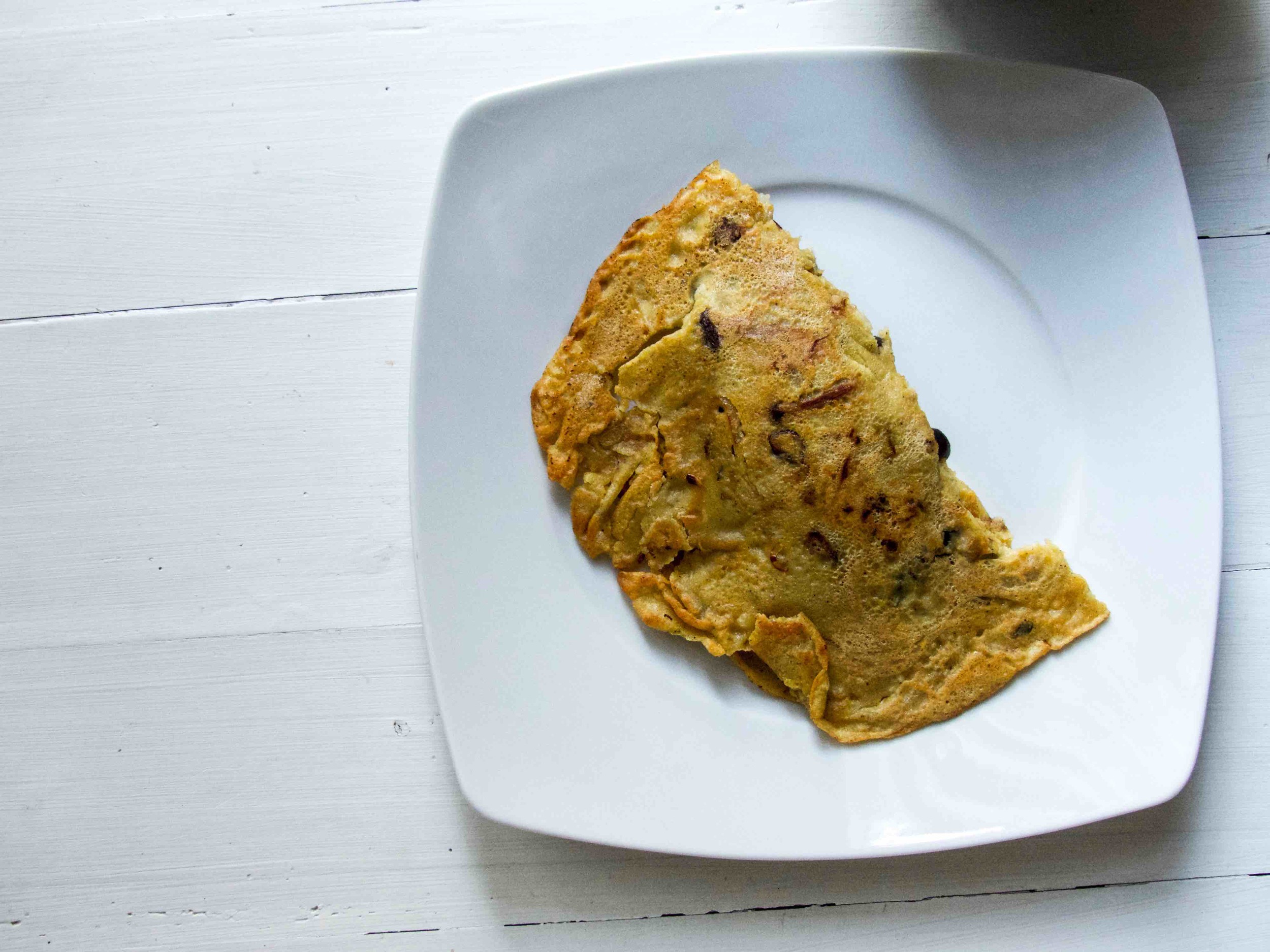 Preheat the skillet with a drizzle of oil on medium heat, spoon in the batter and spread it evenly. Cook for 2-3 minutes with the lid on before flipping to the other side. After flipping to the other side, cook for another minute or two with the lid on. Heat off. 