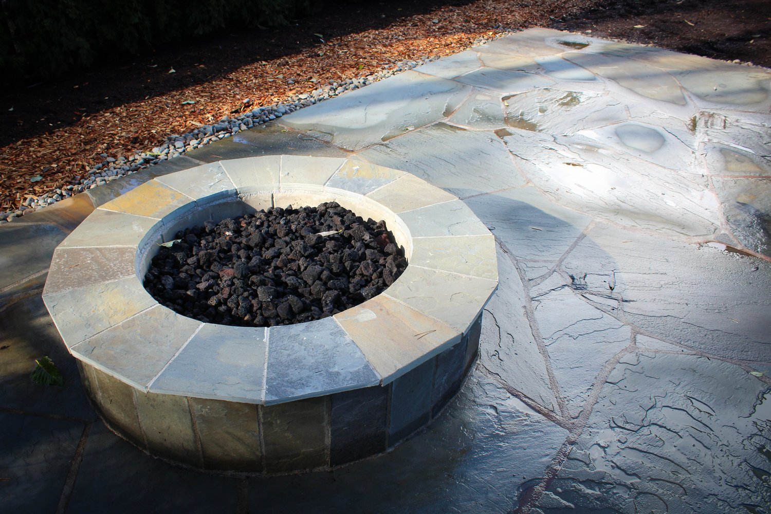 Fancy Stone Tile Patio and Fire Pit - Grasstains Landscaping