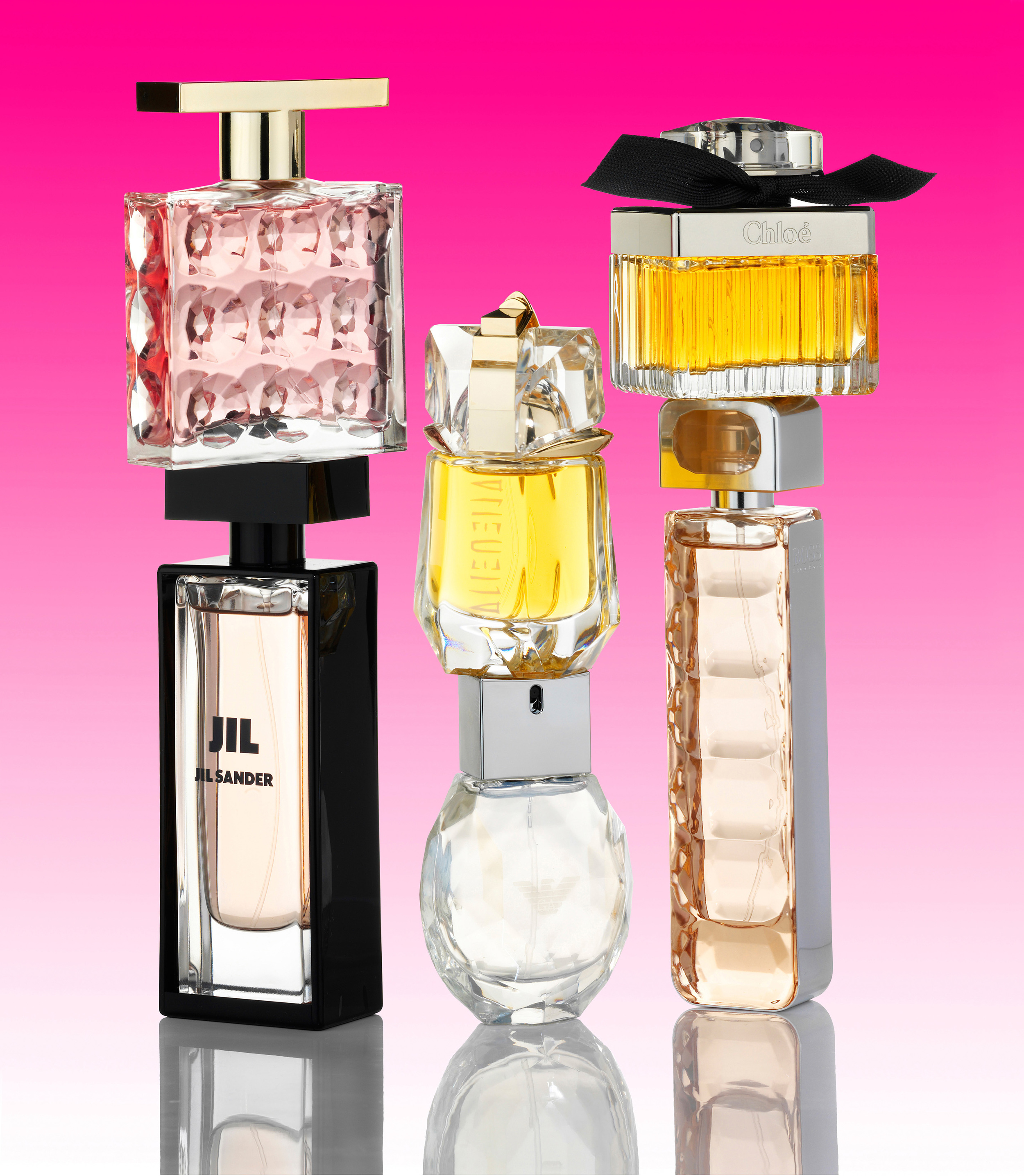 Perfumes on pink grad.jpg