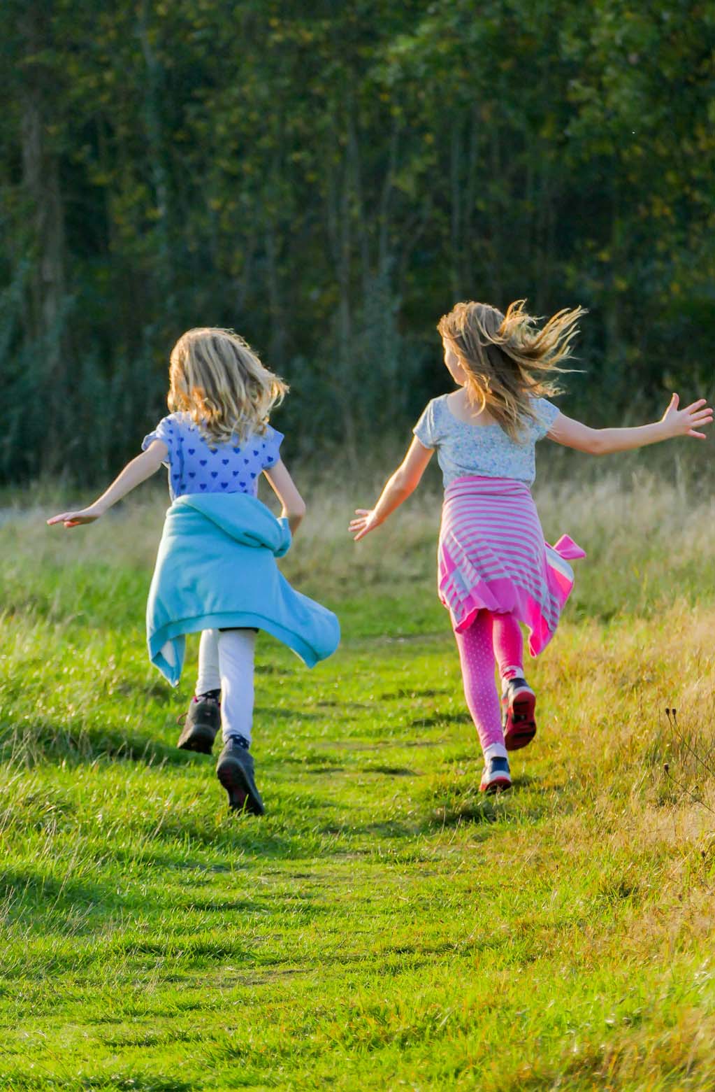 girls running in the meadows.jpg