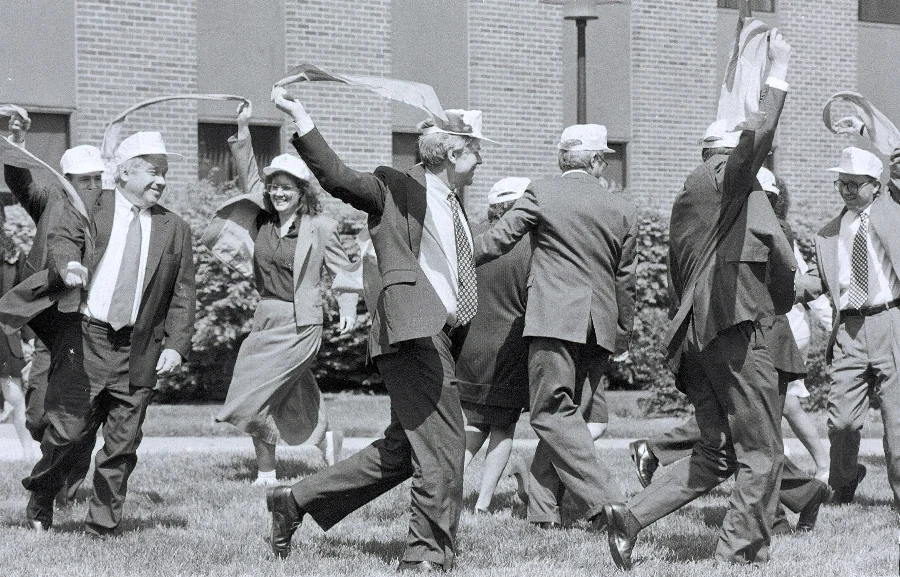 May Day For The Suits