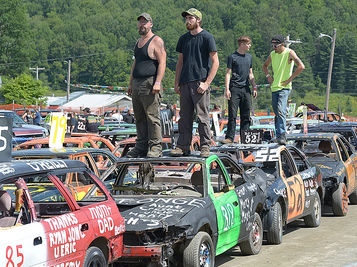 Barton Fair August 2018, Demolion Derby contestants watching the contest as they await their turns to compete.