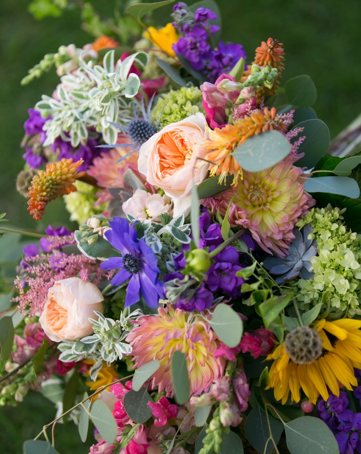 With the bride’s only request being a lush, garden feel, we were able to take our creativity to new places with endless colors & textures. The result? Flowers that the bride was both delighted with & were totally unique! Photo by Jennifer Driscoll Photography.