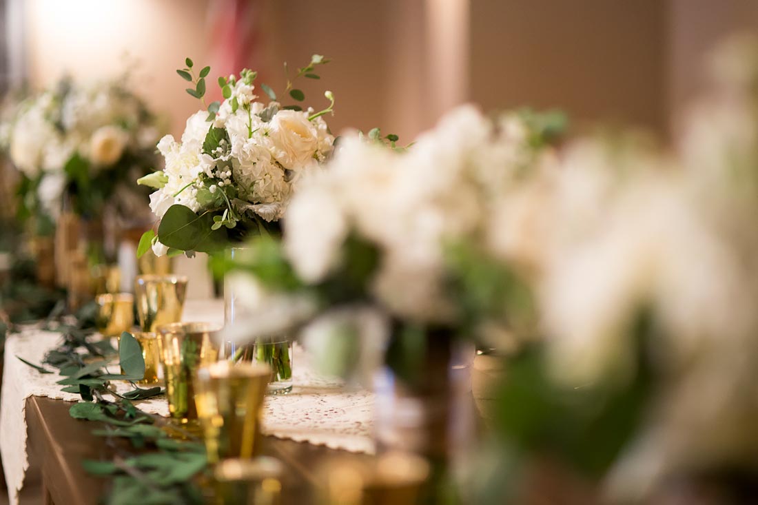 -Quick Tip: Placing your bouquets in vases on the head table adds visual interest & keeps your flowers happy & hydrated! Photo by Grace Pulver Photography.