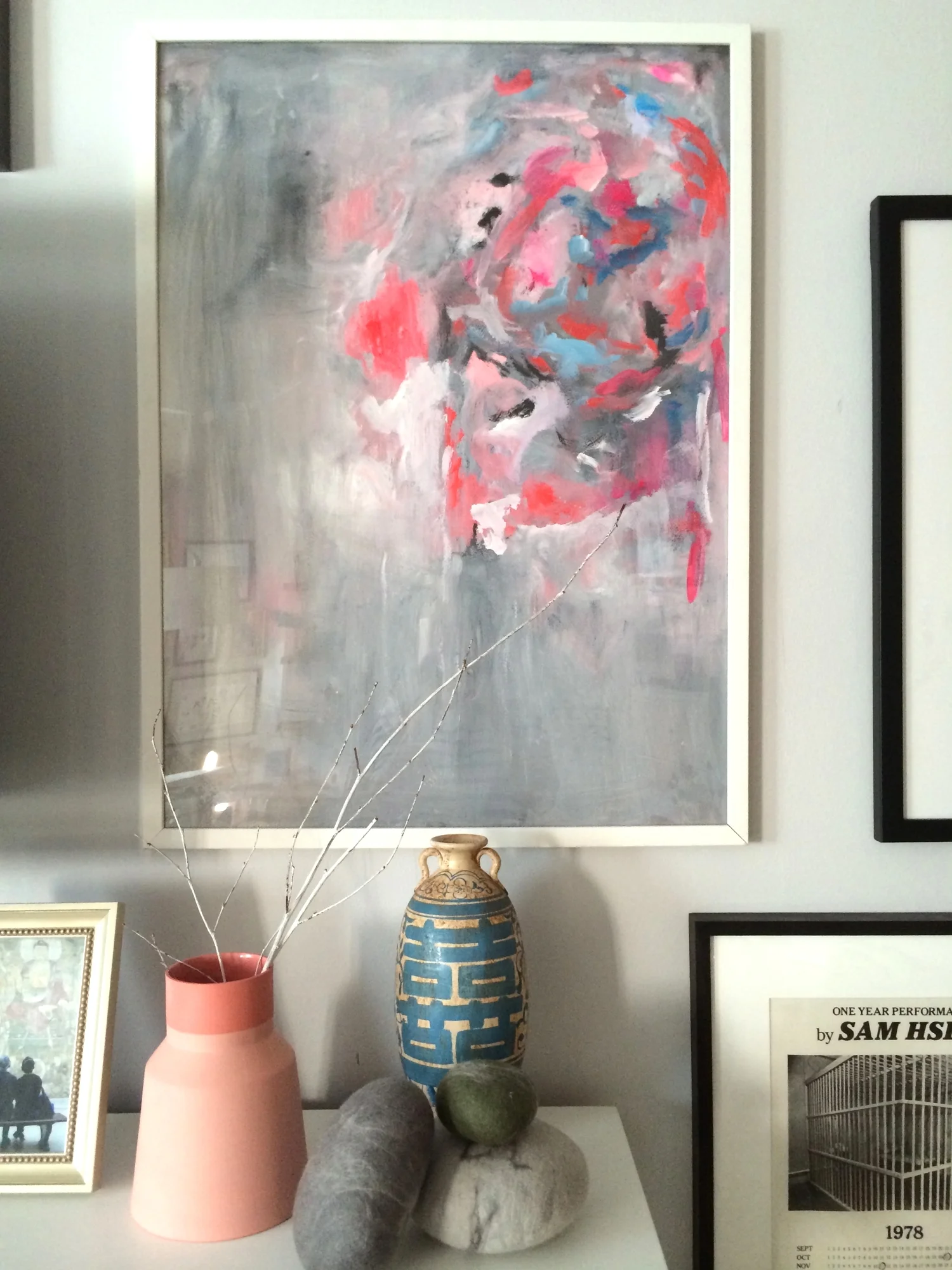 the two-tone peach vase came from culture + commerce project in hudson, ny; the blue vase is an "antique" from panjiayuan market in beijing; the felted stones are from the art institute of chicago 's gift shop.