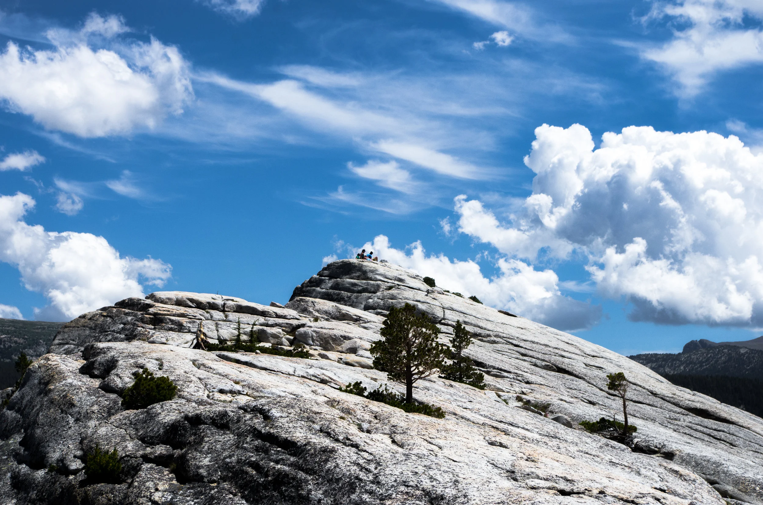 Hikers atop Lembert Dome. Tuolumne Meadows, Yosemite National Park, CA