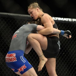 Ronda Rousey knees Sarah Mcmann, ending the fight at UFC 170.