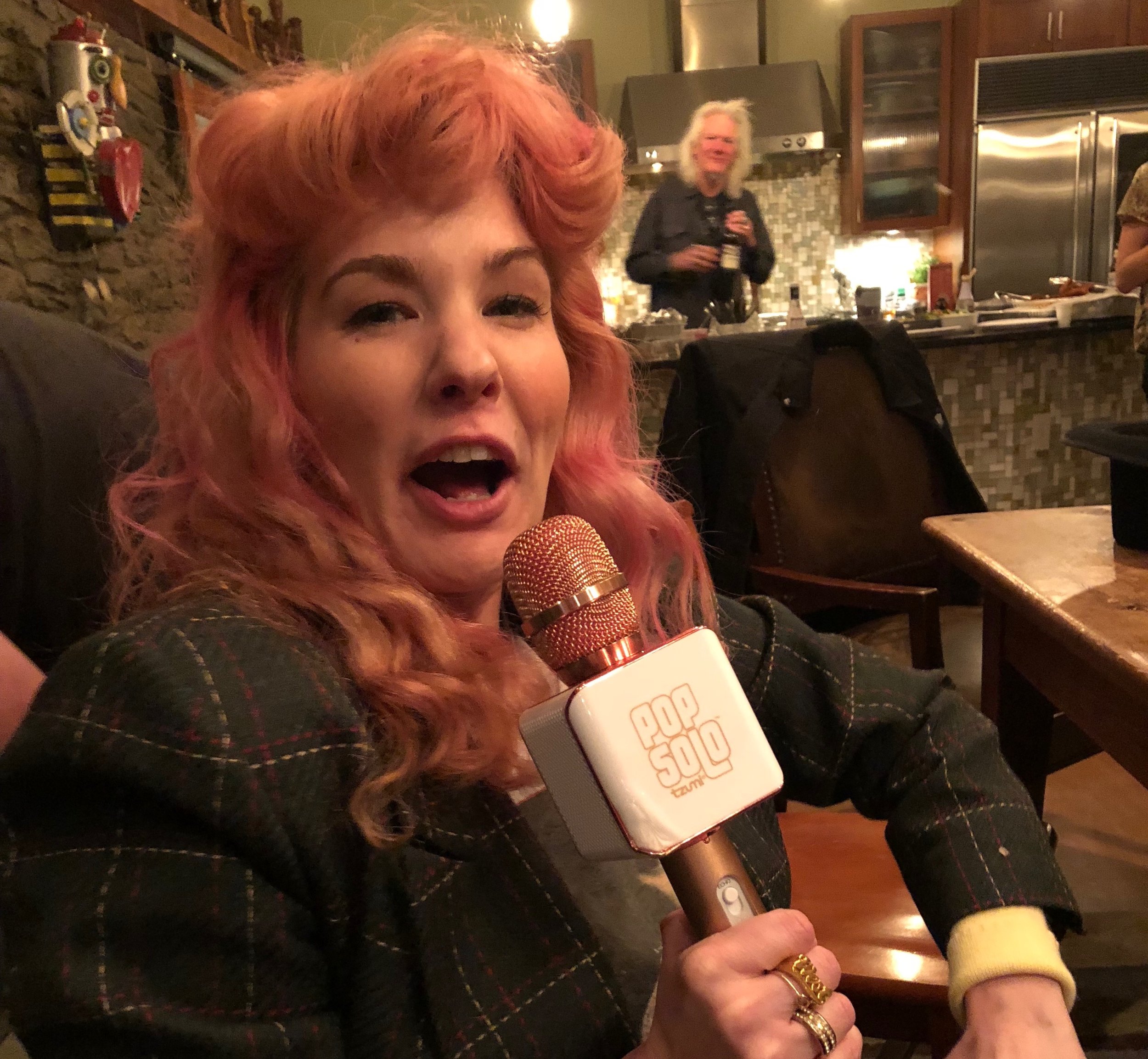  Check out her $19.99 Pop Solo mic! I need one of these too! (That's Skip in the back). 
