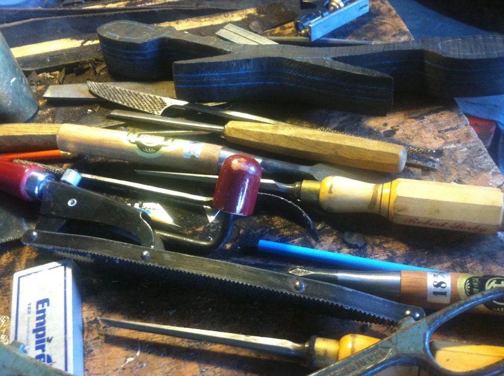 Pictured here are various tools I might use when shaping wood. There is a Shinto Japanese rasp, various sharp chisels. Also, I use a pattern maker's vice.