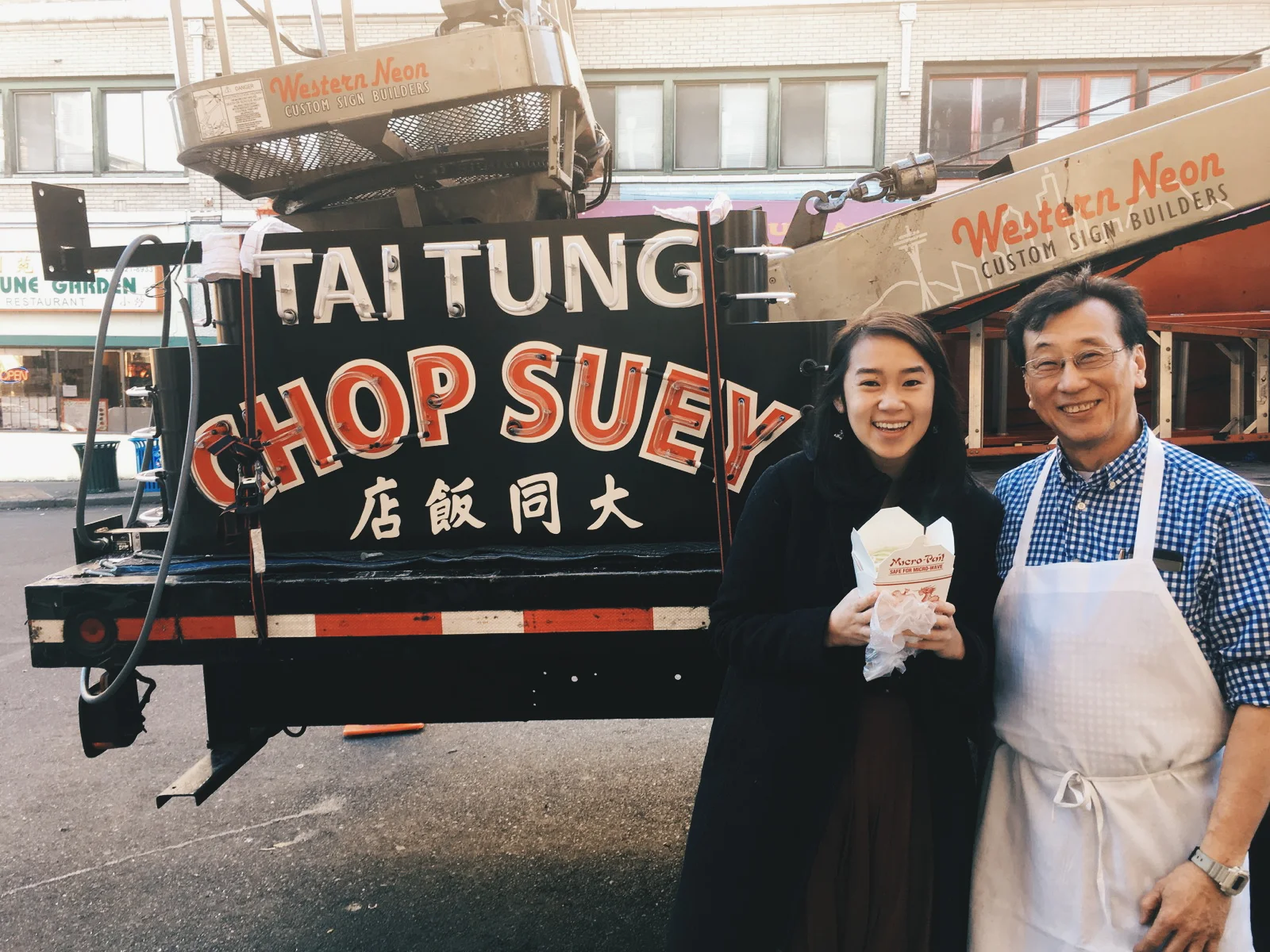 Me and Harry Chan, the owner of Tai Tung, standing next to the sign before it was installed. I am holding a to-go box filled with chop suey.