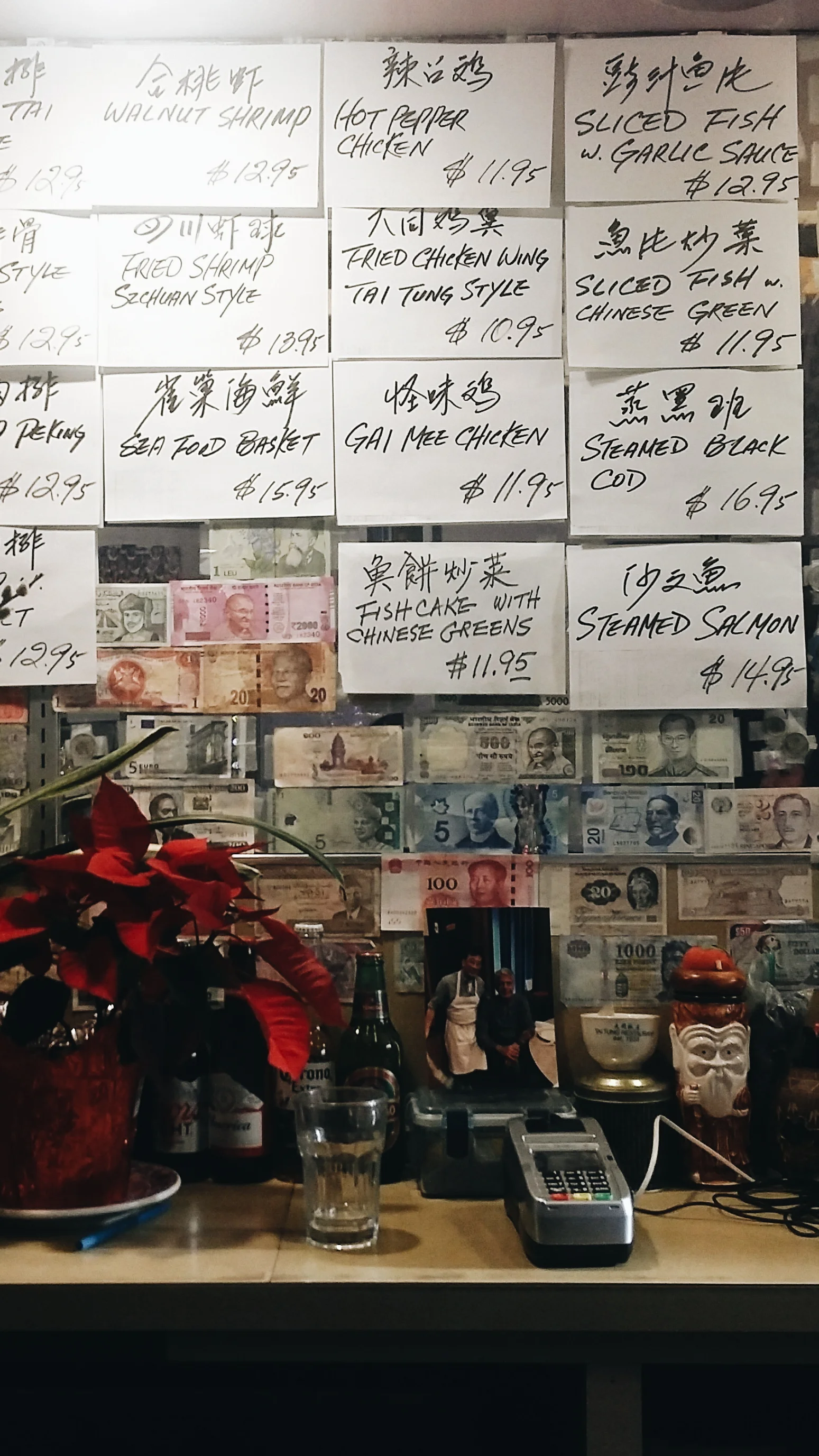 Tai Tung hasn't changed much since it opened in 1935. From the bar, you can see handwritten menu items taped to the mirror. 