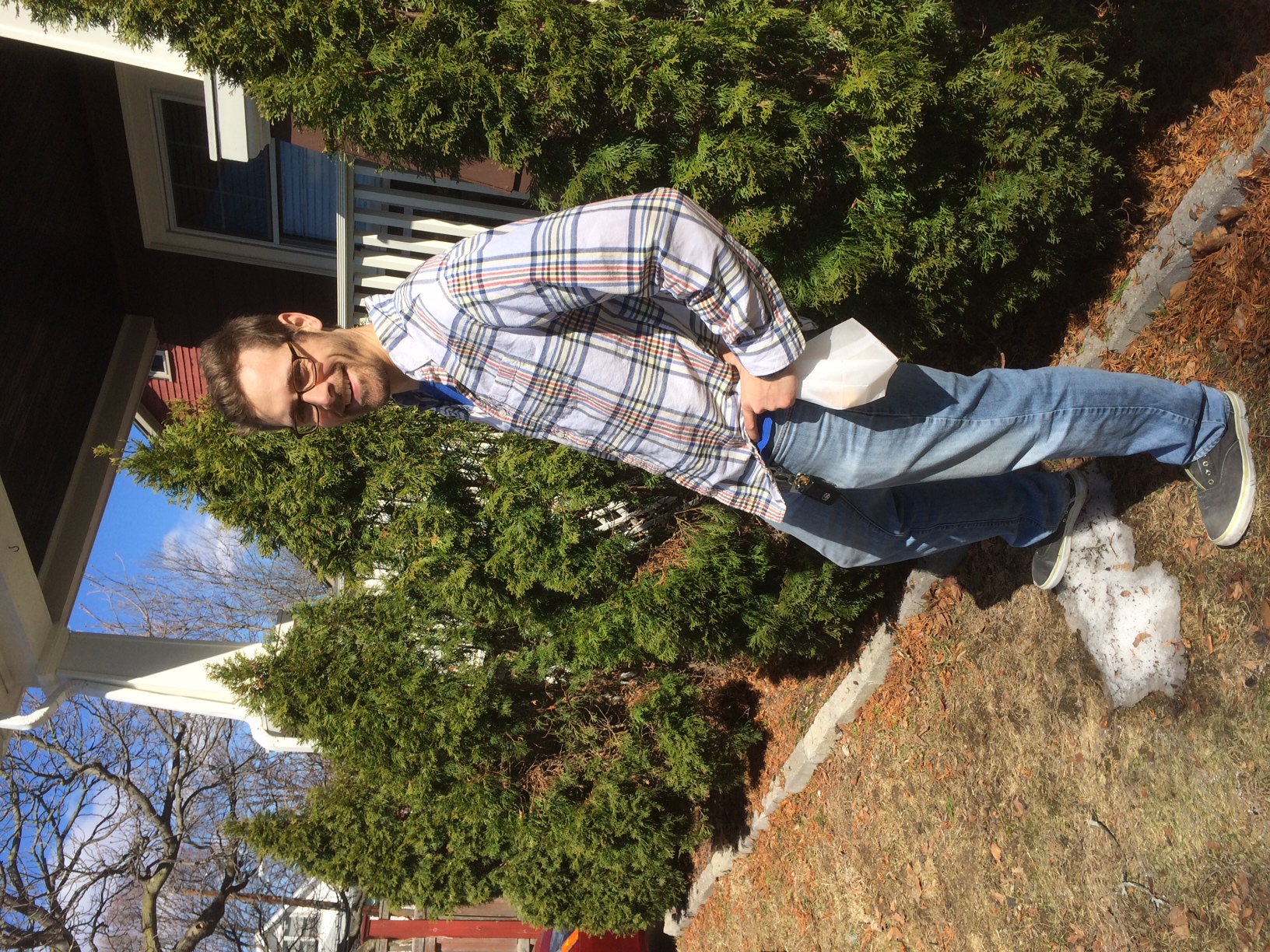 Chris conquering the last snow pile in our front yard. 