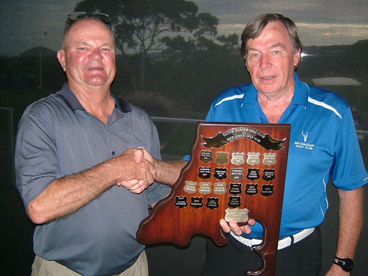 Photos attached show David HOLIS (VHGC Capt – Left) retaining the Men’s trophy from John HARTMAN (McCracken Capt)