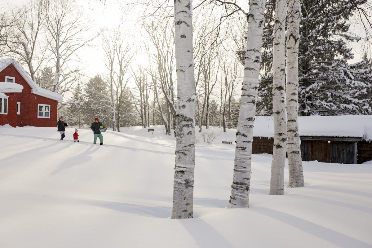  Like many Finnish-American Families in Upper Michigan, the Kipela family makes their weekly trip to their sauna through knee deep snow. Recently moving back into their grandparents original homestead in Atlantic Mine, Upper Michigan, Sam and Amanda 