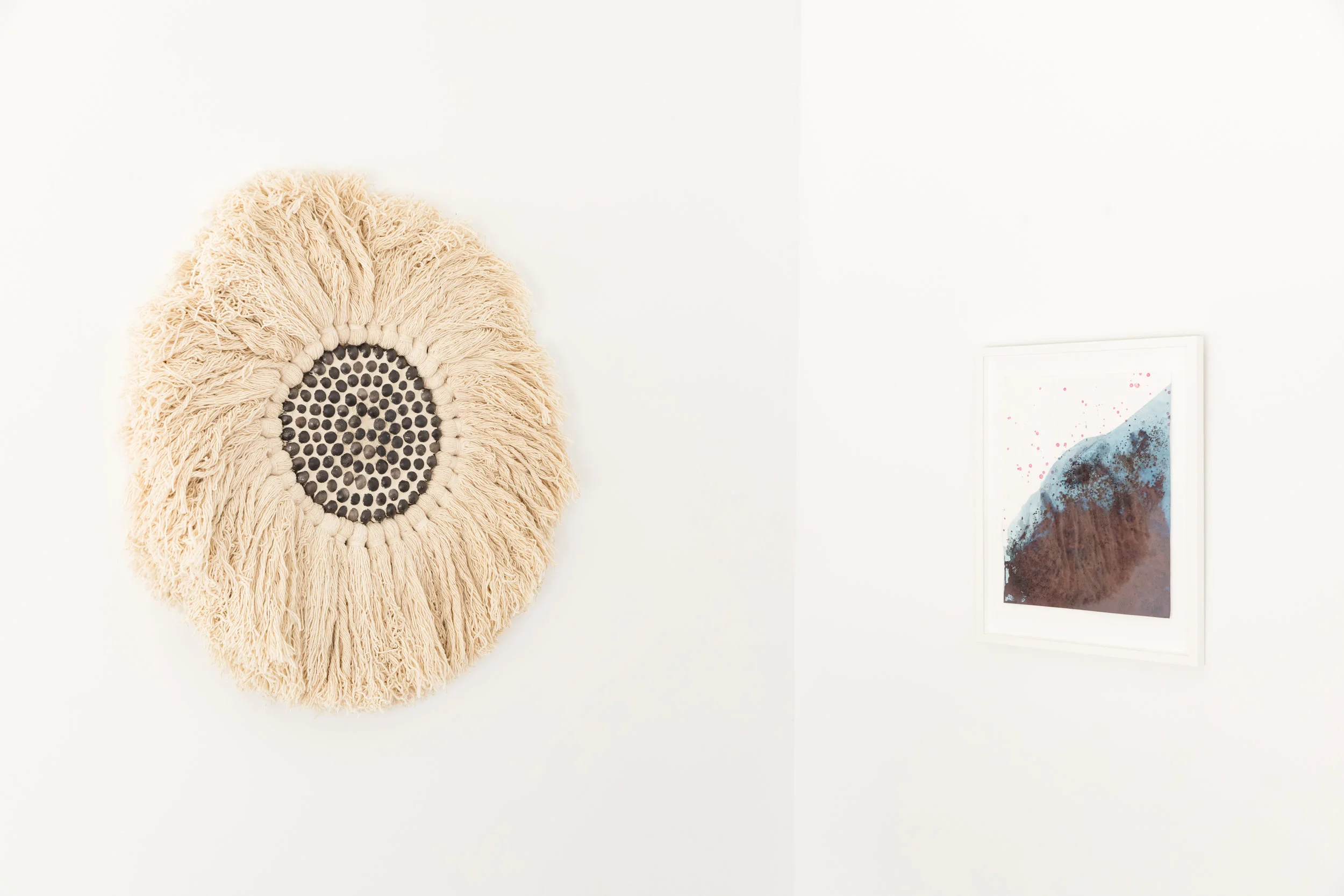 Magic Eye , 2018, Oaxacan black clay, sand, merino on wood panel, 36 inches diameter Texas Desert II , 2017, cotton paper, indigo, poke berries, 21.5 x 25.5 inches framed