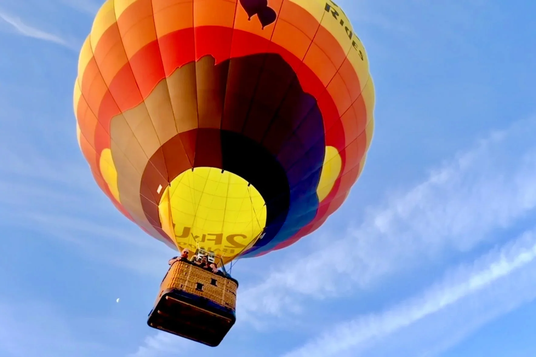 Hot air balloon flying overhead in the Flathead Valley