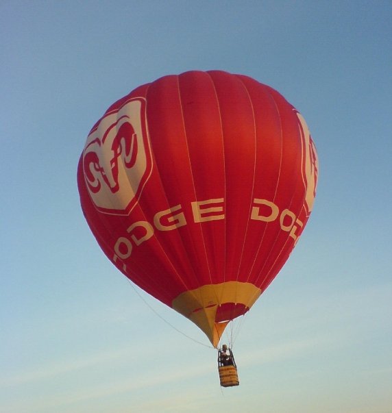 Dodge advertising hot air balloon in flight.