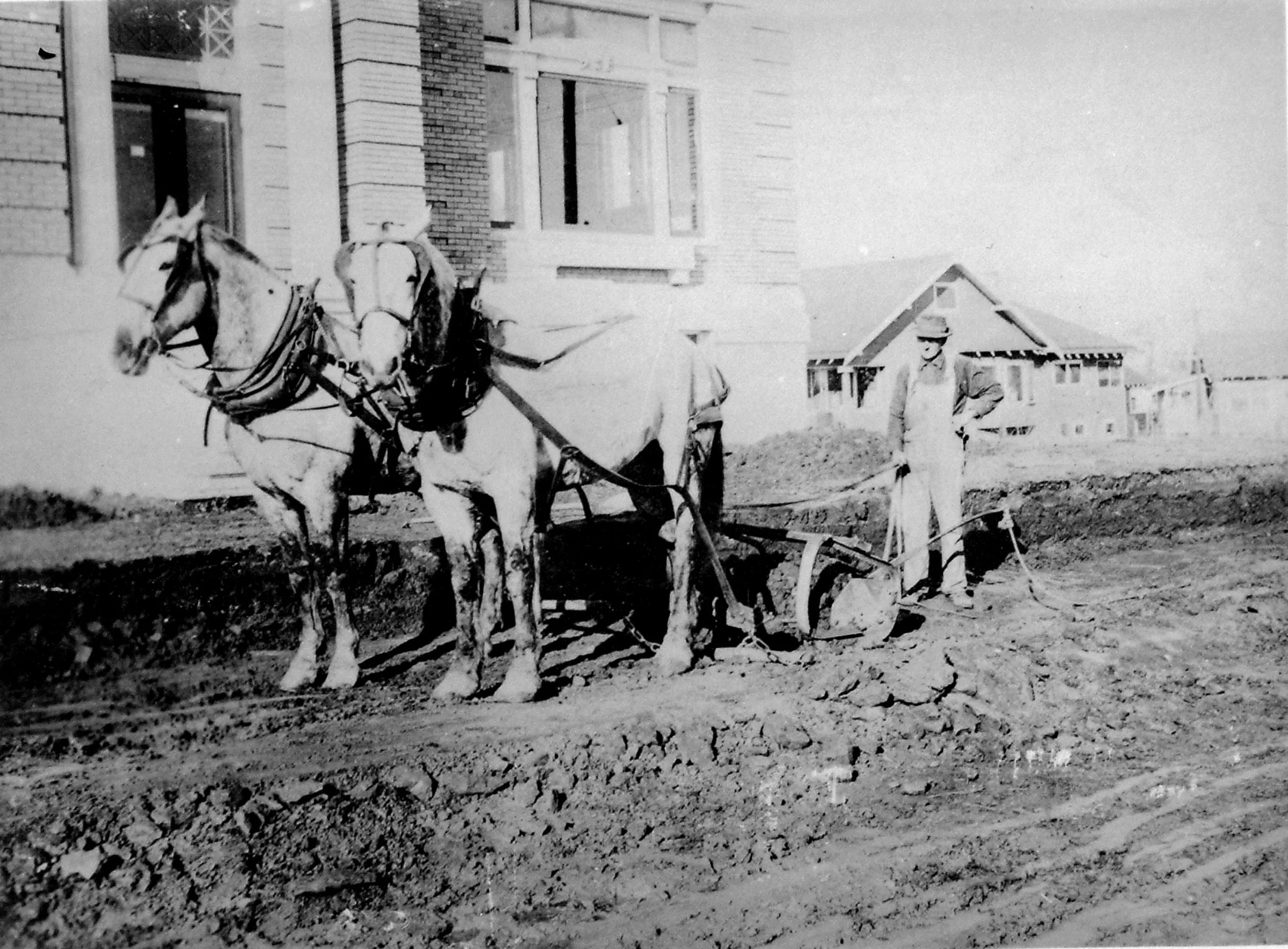 William Keehner grading Lincoln Street in front of the new Public Library.