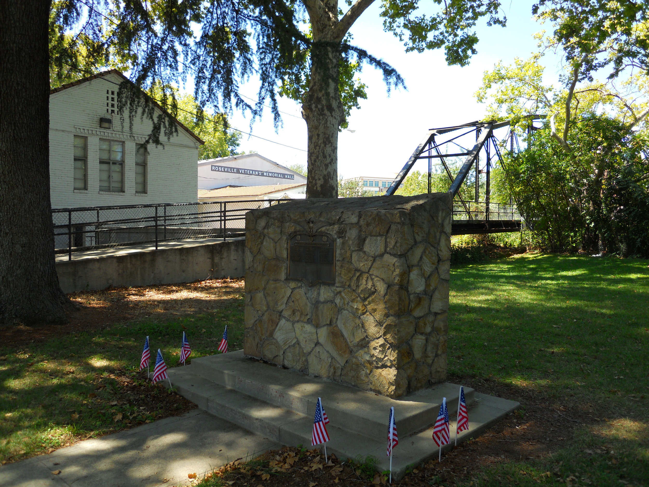 Notice the PFE footbridge, another point of historical interest, behind the monument. The bridge once crossed over the railroad tracks but today it crosses Dry Creek, connecting Royer Park to Oak Street.