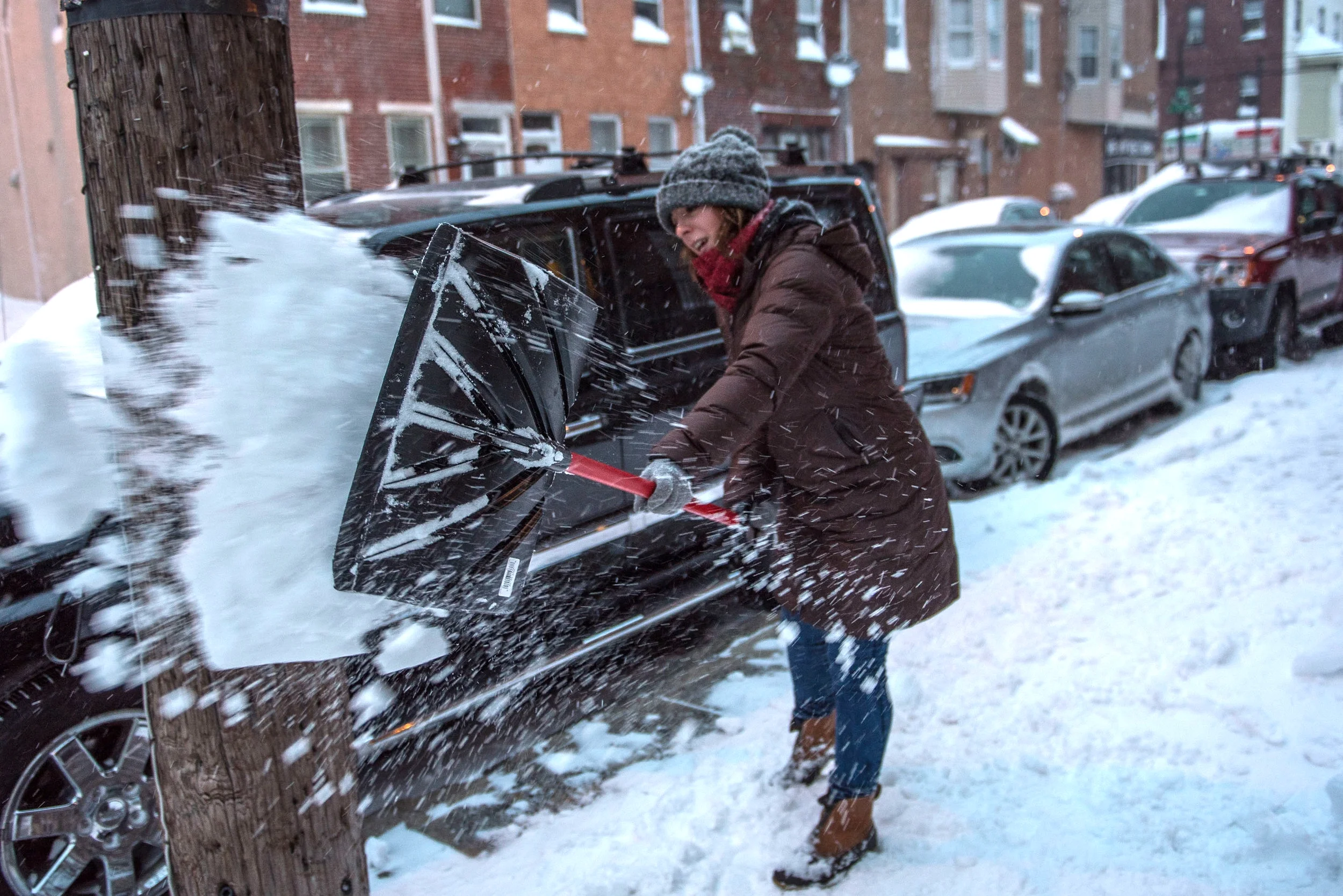 Dee cleaning her South Philly sidewalk area. 
