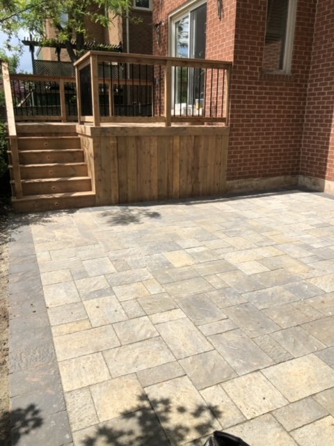 Deck and patio area in a compact backyard