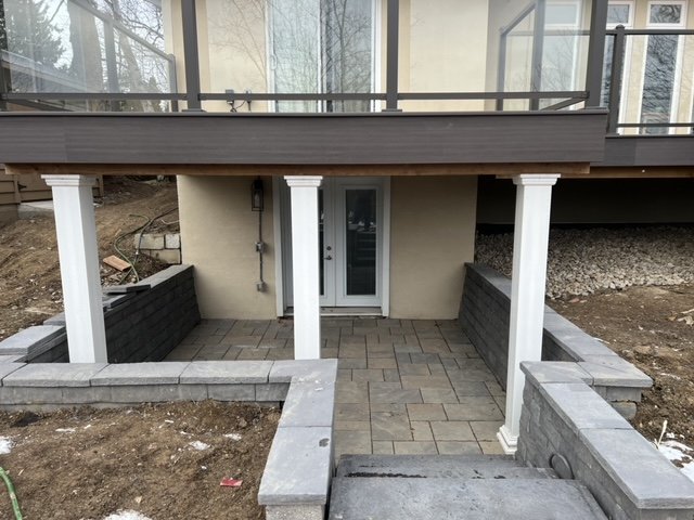 Two levels of backyard fun from a deck and patio area by Burloak Deck and Fence