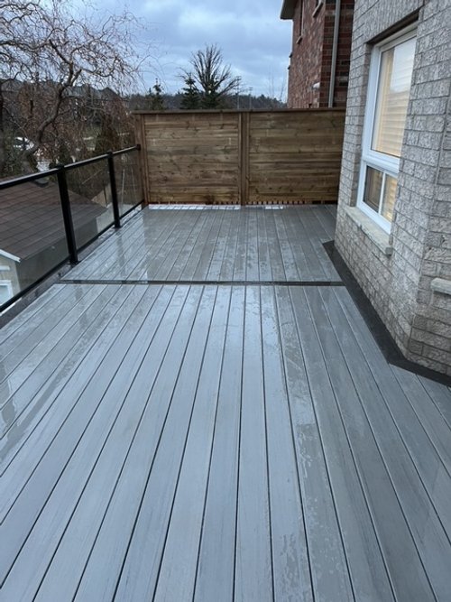 deck on a rainy day with low maintenance composite decking