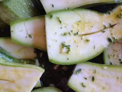 Summer squash marinating before grilling