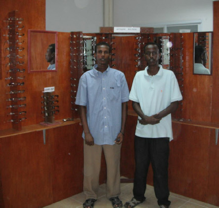 Recent graduates in their new facility for making and selling glasses in a district hospital.