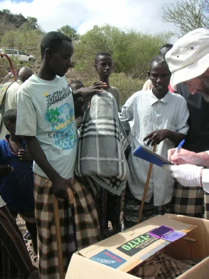 Careful records are essential in distributing goods. Recipients are recorded and marked with indelible ink to ensure fair and responsible allocation and to provide accountability to donors.