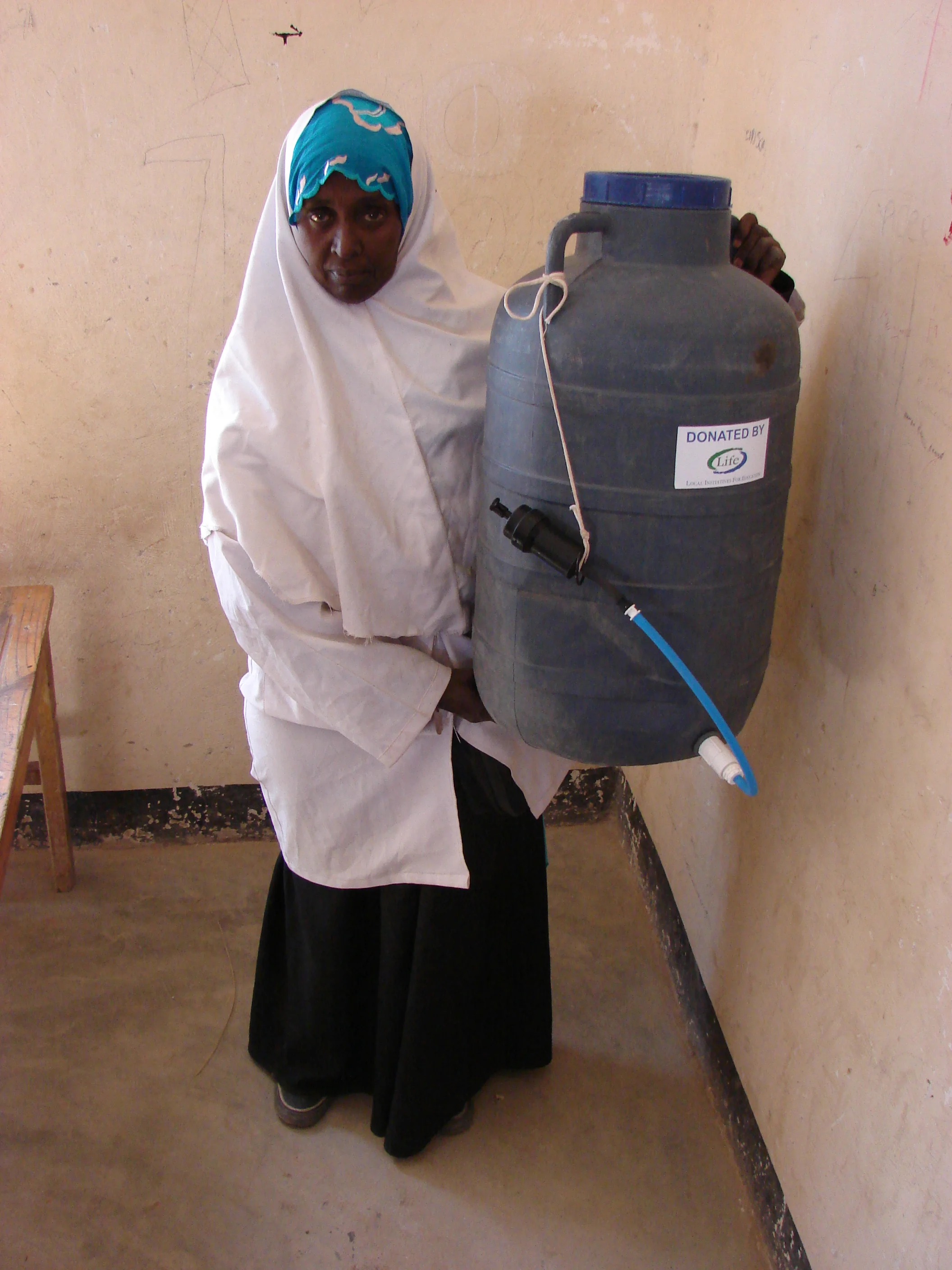 Farhia Hussein is a professional nurse from Southern Somalia. She left Mogadishu after her husband was killed in the fighting. She has 5 children and is volunteering in the makeshift clinic. There are more than 100 people visiting the clinic on a daily basis and one of the biggest problems is diarrhea due to lack of hygiene. She is very thankful for the filters and believes that it will make a difference in the camp.