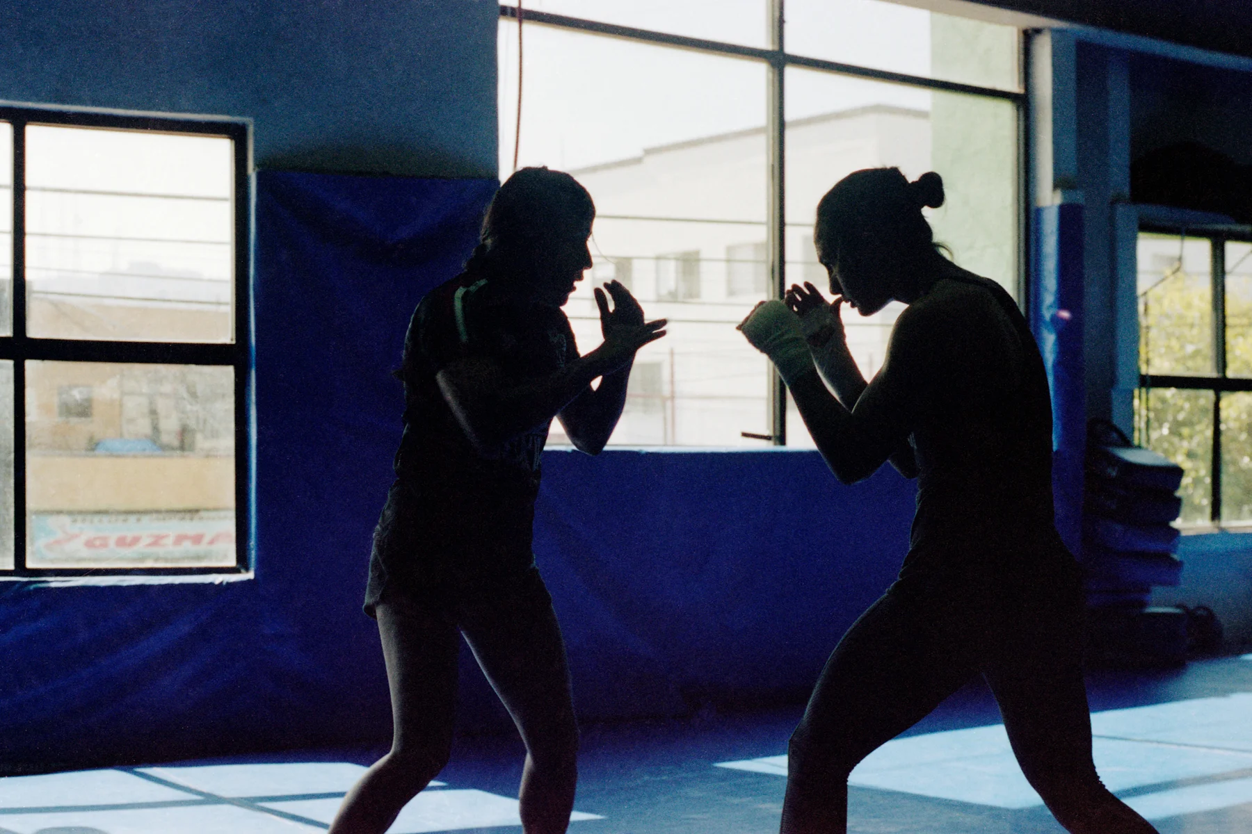 February 27, 2019 - Tijuana, BC, Mexico: Kenia Enriquez, left, practices MMA techniques with jiujitsu champion Yasmin Gutierrez Jauregui, right, at Entram Gym. (Mallika Vora)
