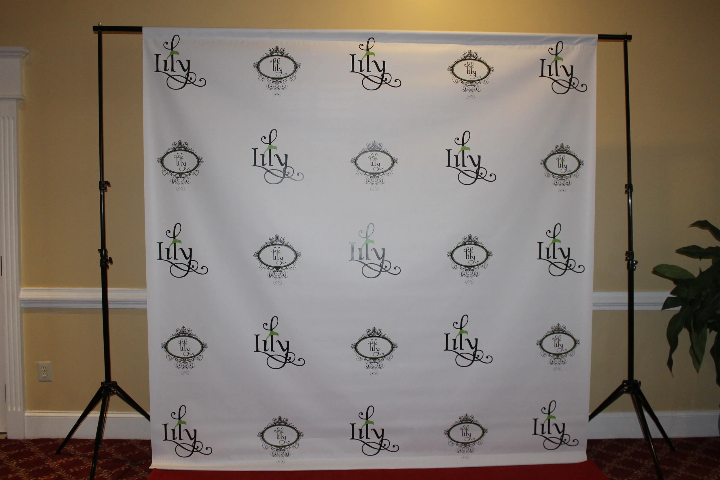 25. Graphic Backdrop of Custom Lily Logos.JPG