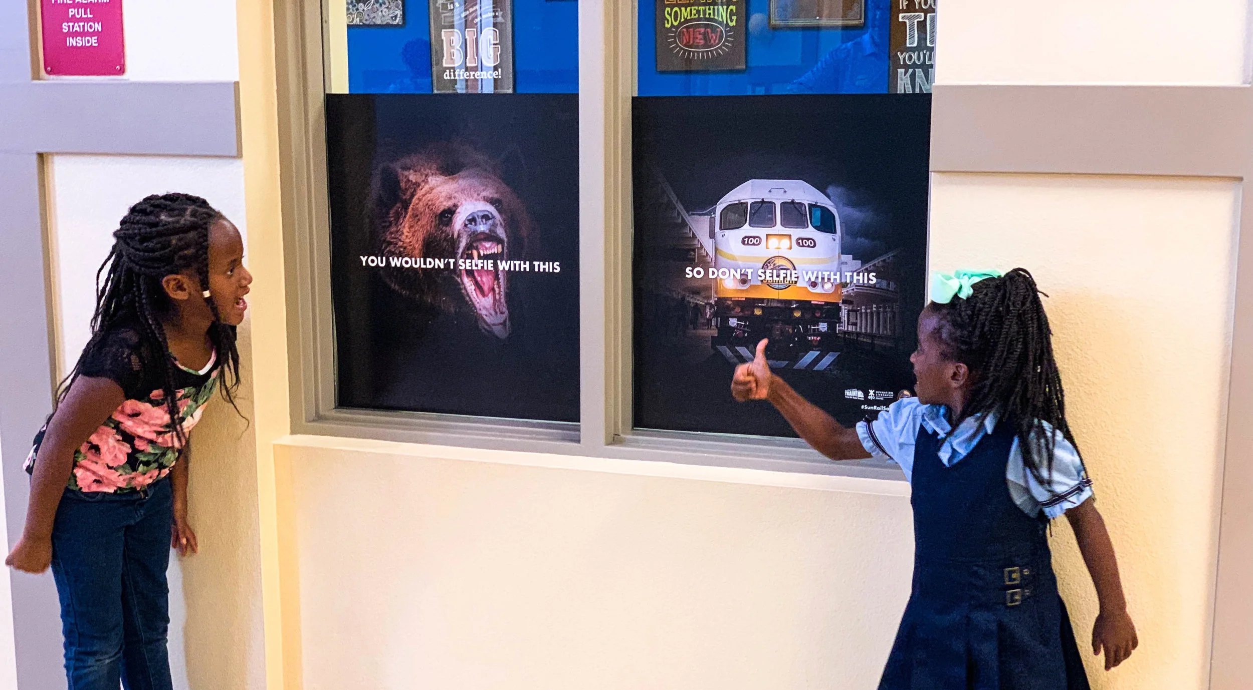 Kids stop in their tracks to check out the eye-catching safety clings installed at their school.