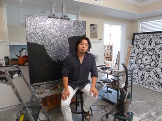 Chinese contemporary painter Caomin Xie pictured in his Atlanta, GA studio with works in progress, July 2015