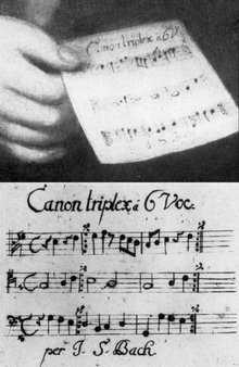 J.S. Bach, Canon triplex a 6 vocibus (canon for six voices) was presented as his ‘entrance work’ to Mizler’s Societät and is also the one that he holds in the Haussmann portrait.