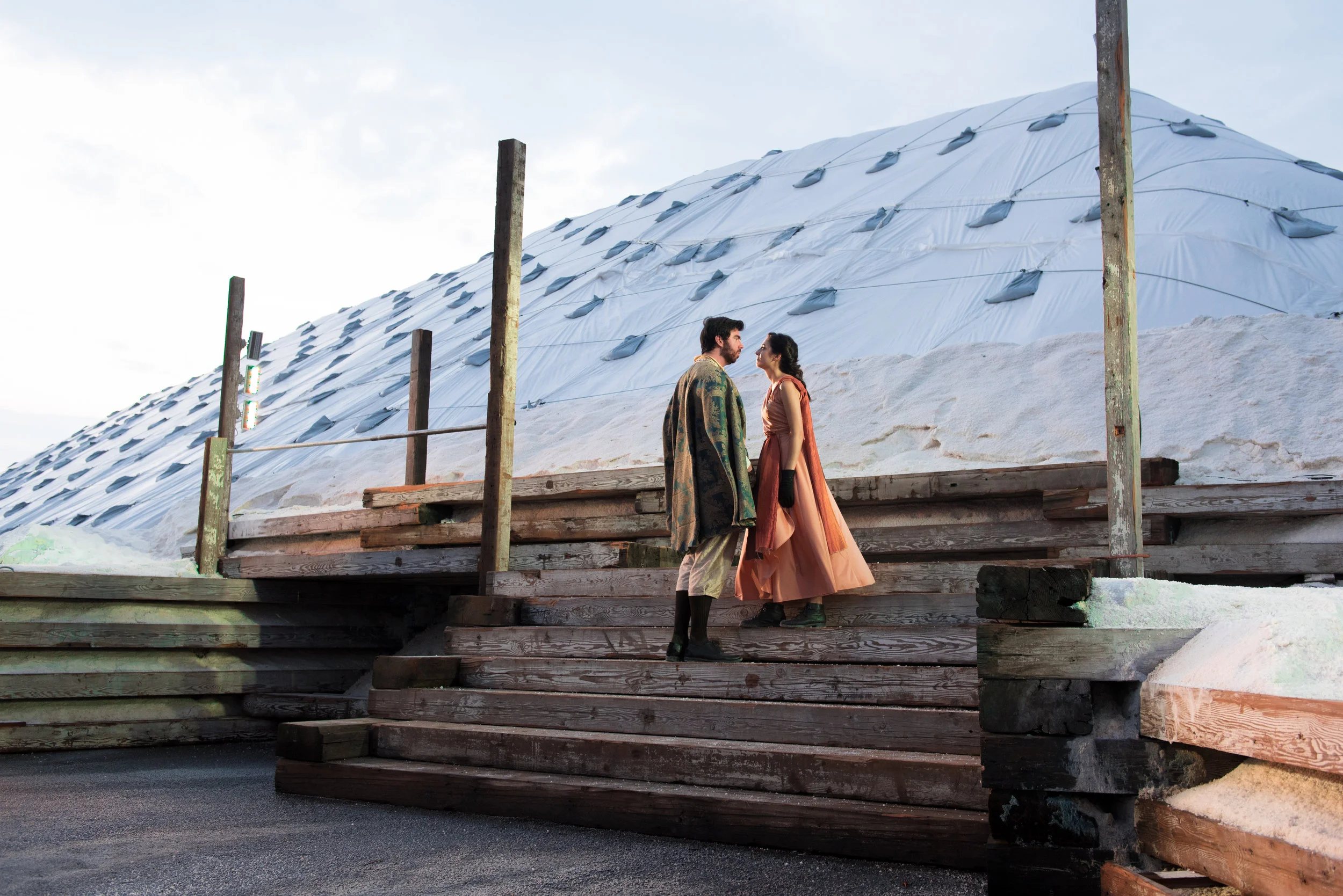Actor John Manning as Demetrius and actress Kelly Young as Helena shared an intense moment against the luminous salt pile backdrop. The salt white mounds offer a unique landscape for the Apollinaire Theatre to allow its creativity to shine through on.