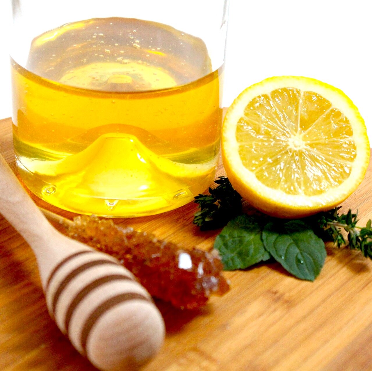 a glass of water with honey, lemon and olive oil every