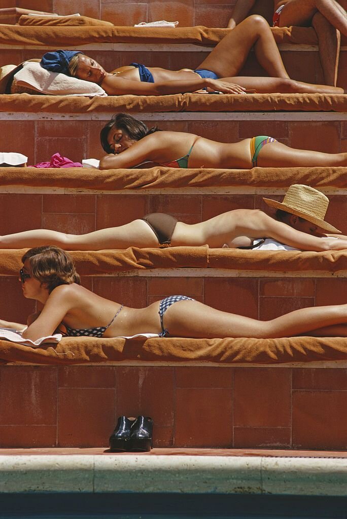 sunbathers-by-a-swimming-pool-at-the-hotel-punta-tragara-on-news-photo-674382855-1560192480.jpg