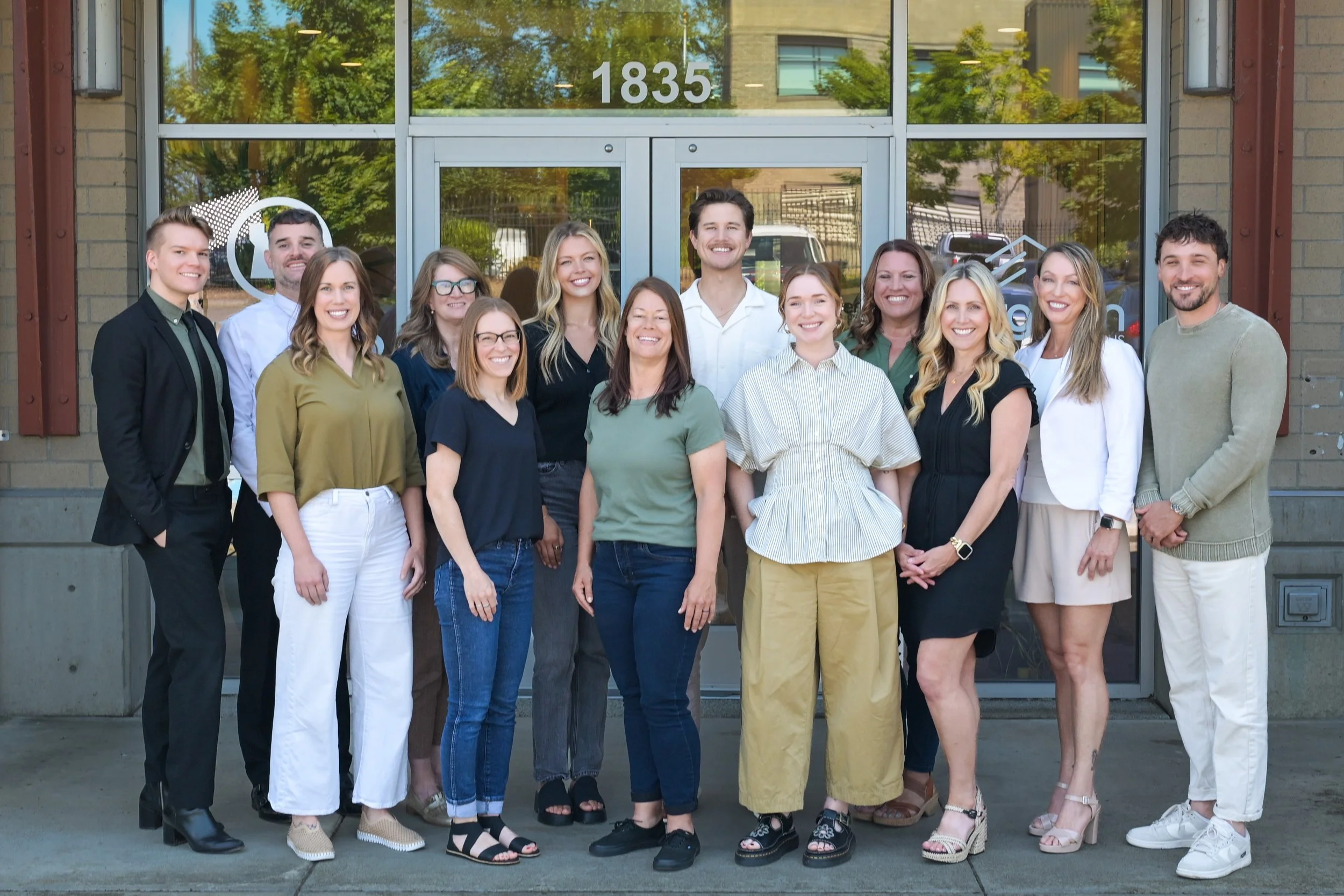Evergreen Home Loans Bellingham team photo smiling and posing for a photo.