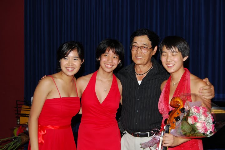 Violin teacher Hua-Yi Wang with the trio