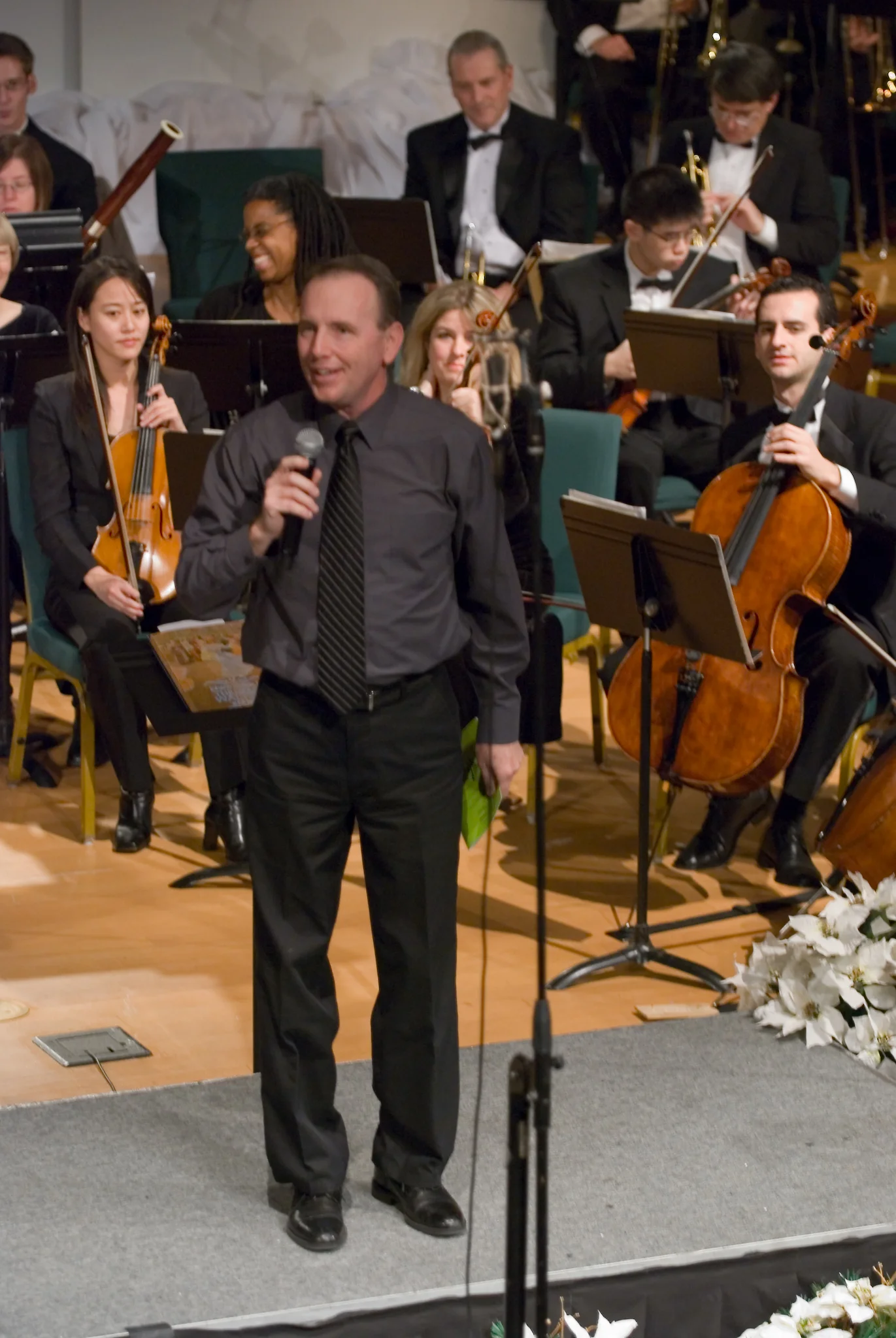 Pastor Boyd Hannold introducing the Orchestra