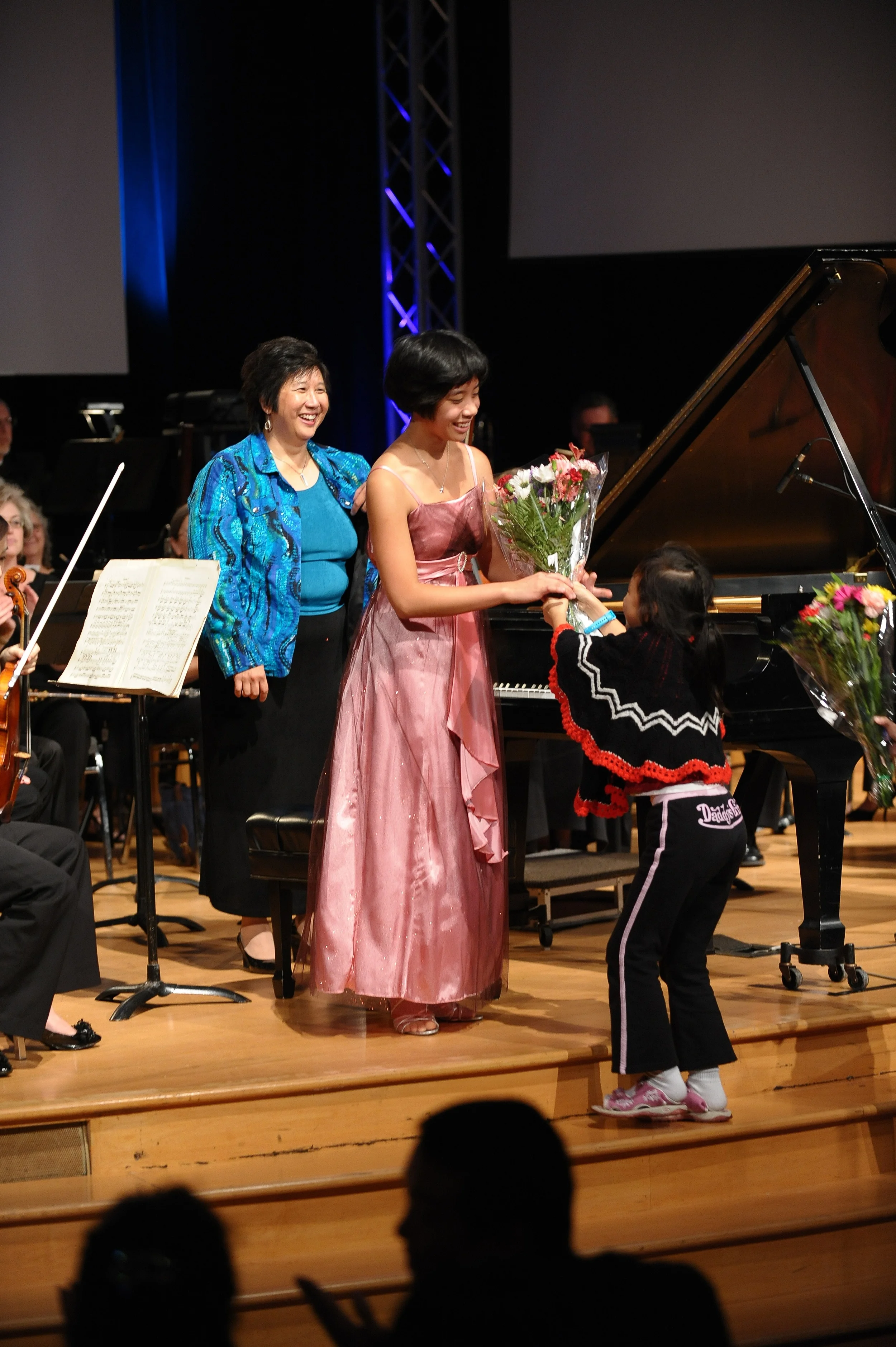 Constance receiving flowers from friends