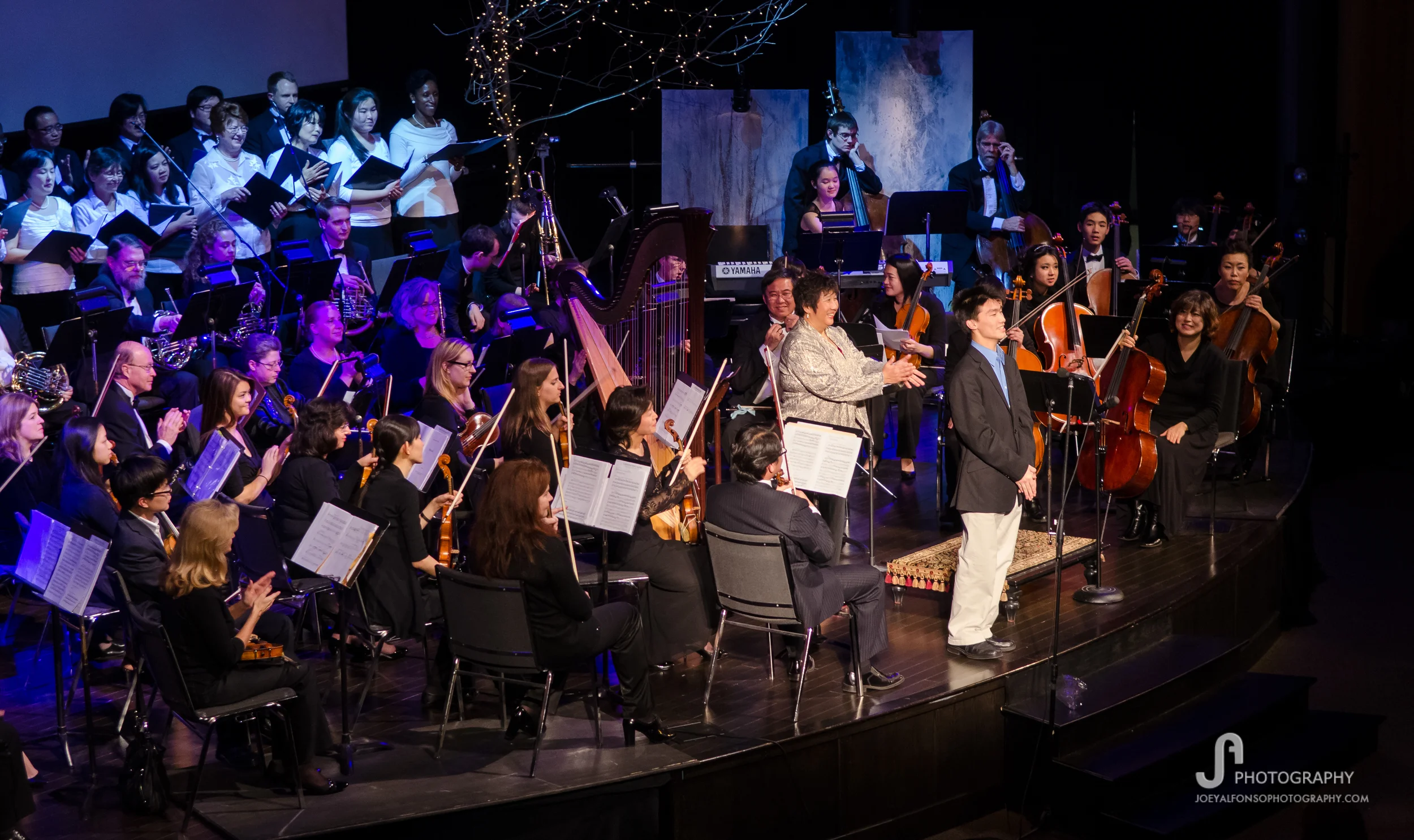 Composer Matthew Liu bows after the premiere of "A Christmas for Everyone"