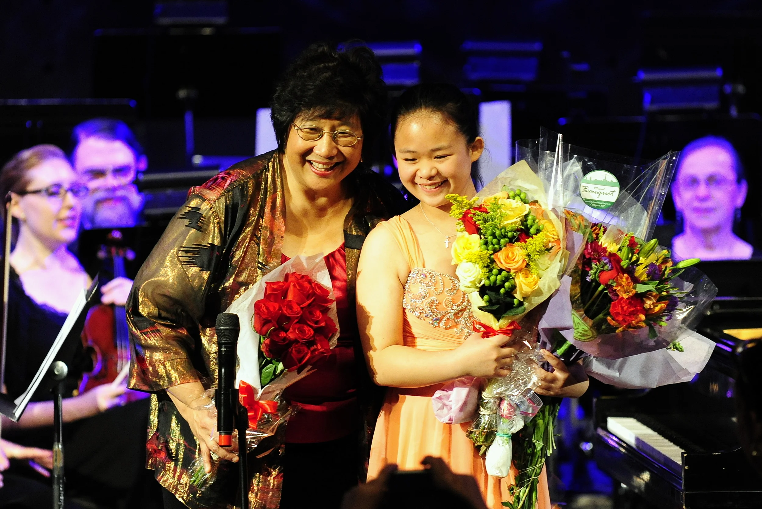 Maestra Lin and Crystal Chiu receive flowers from their many admirers