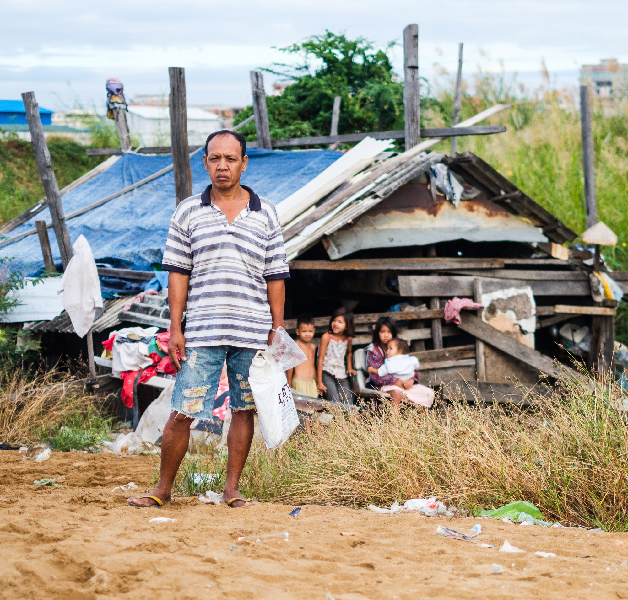 Kim Chantha once made a living from Boueng Kak's bountiful waters, but since the lake has been filled with sand, the former farmer is now forced to collect and sell rubbish to support his family.